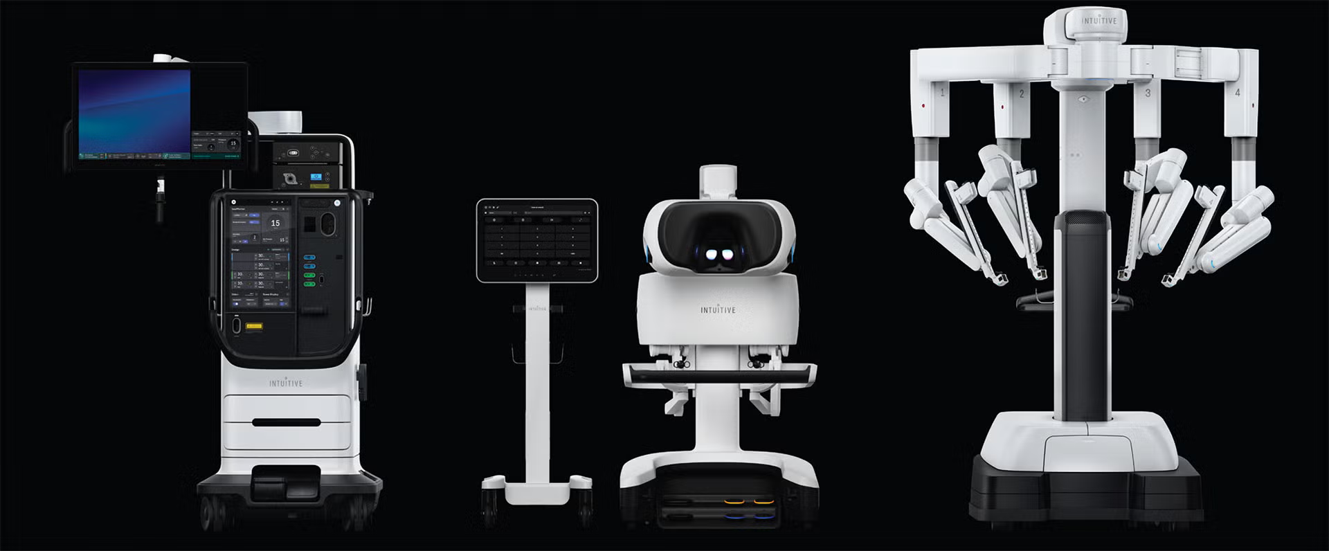 A da Vinci surgical system with robotic arms, surgeon console, and vision equipment against a dark background